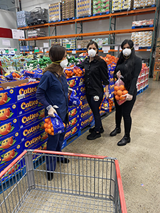 volunteers shopping for food at Costco