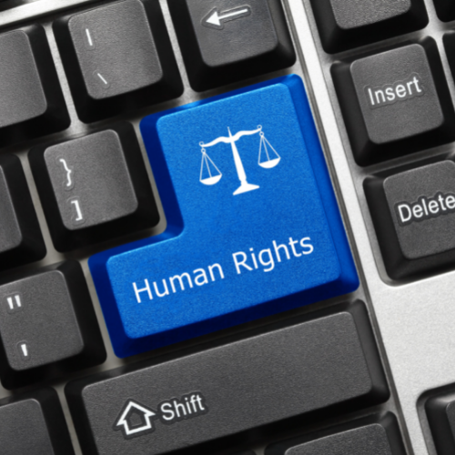 upclose of keybaord with a button that says human rights